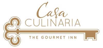 Logo for Casa Culinaria, featuring a stylized key with the text "The Gourmet Inn."
